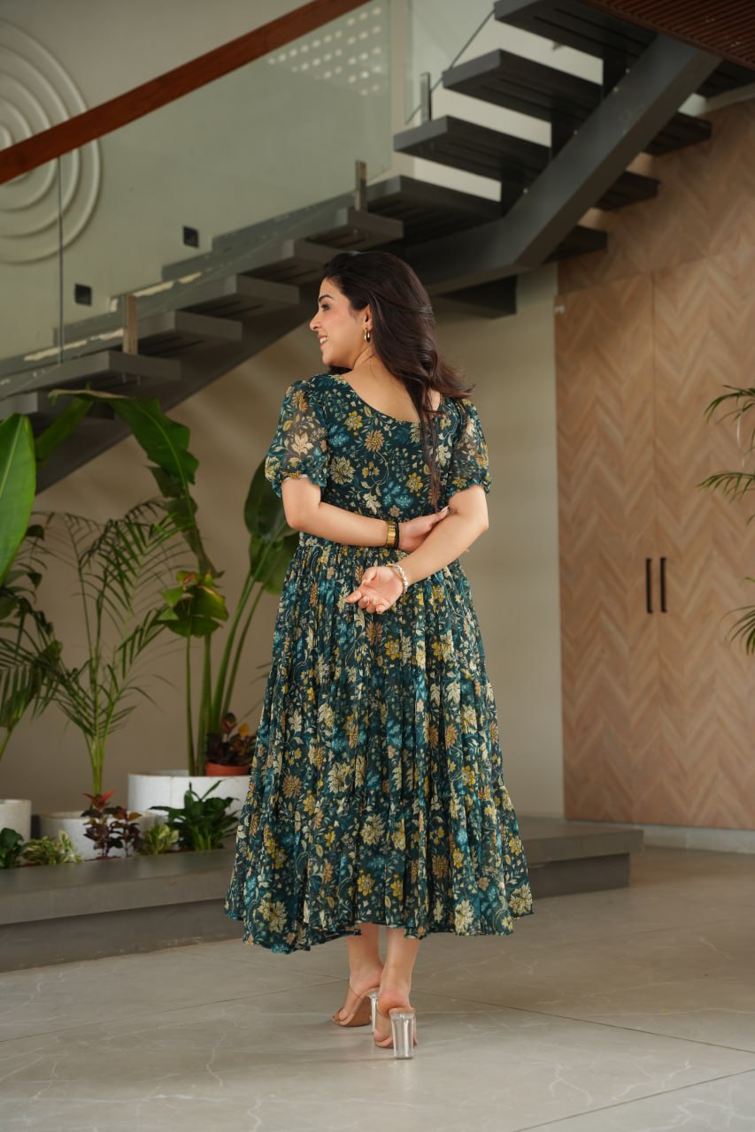 Vikarni Green Printed Anarkali Gown in faux georgette with 12-meter flair – perfect ethnic wear for women, long gown for women, printed gown for girls, Anarkali gown for wedding, georgette gown for festive wear, Indian dress for women, traditional wear for haldi ceremony, party wear gown online, readymade gown under 1000, stylish green ethnic gown for mehndi function.
